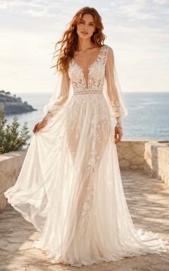 Robe de mariée en dentelle et tulle, coupe trapèze, col en V, manches longues et traîne.
