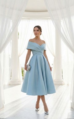Robe sans manches en satin, longueur thé, croisée sur le devant