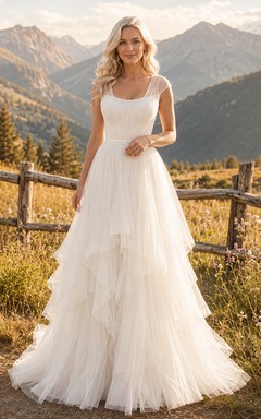 Vestido de novia de tul con escote redondo y capas, estilo pradera alpina, ideal para fugas románticas.