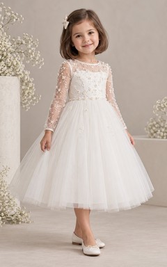 Vestido de niña de flores blanco de manga larga con estampado floral, corte en A, tul, espalda ilusión y corpiño de encaje.