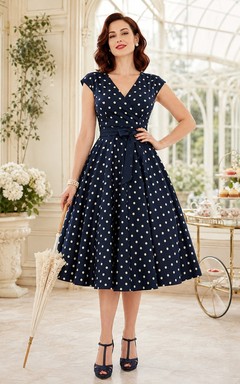 Robe vintage bleu marine à pois en mousseline, coupe trapèze, longueur thé, col en V, sans manches