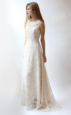 Robe en dentelle sans manches à col rond et dos nu en V, coupe trapèze.