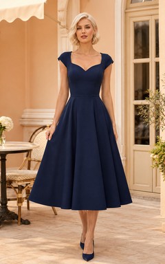 Vestido de cóctel formal clásico de satén azul marino oscuro con escote corazón, mangas cortas, corte en A y largo hasta la rodilla.