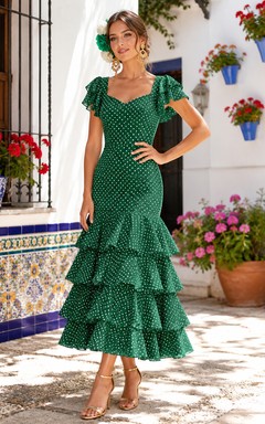 Dunkelgrünes, weiß gepunktetes Meerjungfrauenkleid von Feria mit eckigem Ausschnitt, flatternden Ärmeln und Stufenrock in Teelänge und eckigem Ausschnitt.