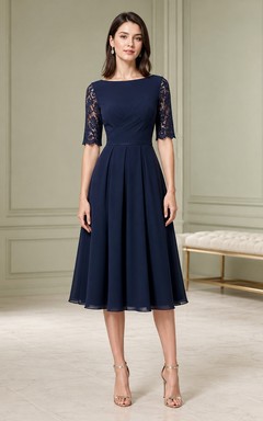 Vestido vintage azul marino de encaje con cuello joya, manga tres cuartos, corte en A y largo hasta la rodilla.