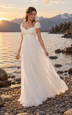 Vestido de novia de gasa de corte A con escote corazón, manga corta, corpiño fruncido y falda fruncida.