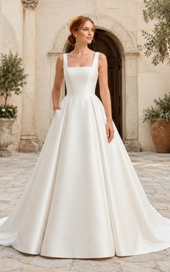Vestido de novia de satén, estilo princesa, con escote barco, manga corta y cola de capilla.