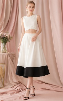 Vestido formal moderno de dos piezas en blanco y negro, sin mangas, de satén, largo hasta la rodilla, para invitadas.