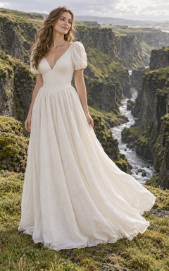 Vestido de novia sencillo de corte A, con mangas cortas abullonadas, escote en V, confeccionado en lino y falda fruncida.