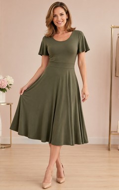 Vestido vintage de manga corta, corte A, largo hasta la rodilla, de jersey verde oliva con cuello redondo.