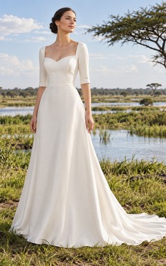 Vestido de novia sencillo de satén con escote corazón, manga corta y corpiño liso.