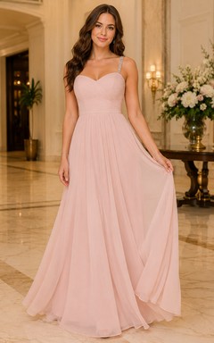 Robe de soirée en tulle rose poudré à décolleté cœur et coupe trapèze