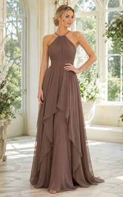 Robe de soirée taupe en mousseline de soie, coupe trapèze, dos nu et jupe drapée