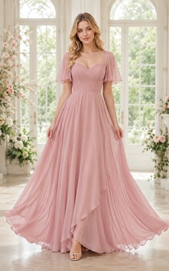 Vestido romántico de tul color rosa empolvado con mangas de volantes y corte en A.