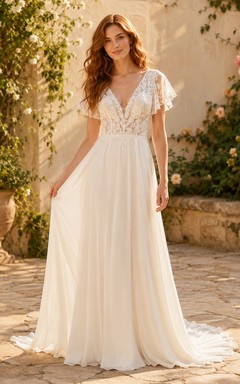 Vestido de novia de gasa y encaje para la playa, corte en A, escote en V, mangas con volantes y cola larga.