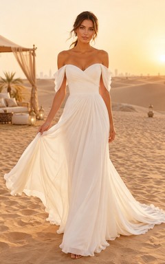 Robe de mariée romantique en mousseline, coupe trapèze, épaules dénudées et décolleté cœur, idéale pour une destination de plage