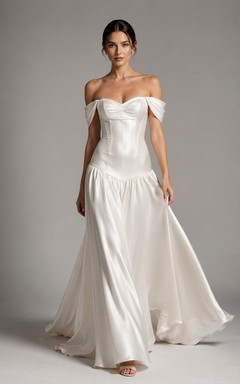 Robe de mariée moderne à épaules dénudées et taille basse, style corset, idéale pour une fugue amoureuse.