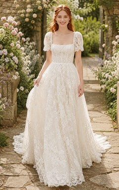 Vestido de novia romántico de encaje con corte en A y mangas abullonadas.