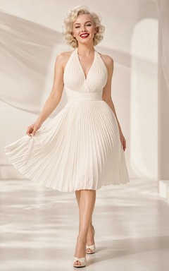 Robe de cocktail vintage ivoire plissée, longueur thé, dos nu et coupe trapèze