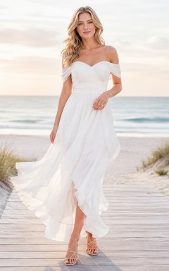 Vestido de novia bohemio romántico de gasa, corte A asimétrico, manga corta y escote Bardot, estilo bohemio, ideal para bodas en la playa.
