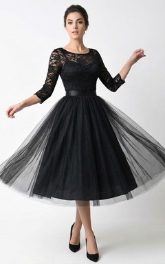 Robe mi-longue en dentelle à manches 3/4 et col rond