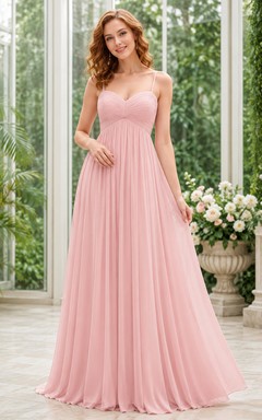 Robe de soirée longue empire en mousseline rose poudré sans bretelles
