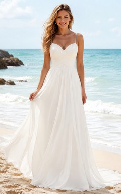 Vestido de novia de gasa con escote corazón y tirantes finos, corte en A, ideal para la playa.