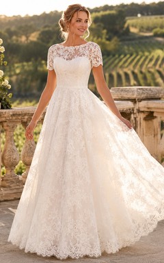 Vestido de novia romántico vintage de corte A con escote barco, mangas cortas y encaje.
