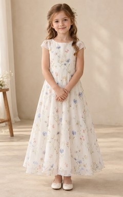 Robe de demoiselle d'honneur ivoire à fleurs, manches courtes et col rond, en mousseline fluide, coupe trapèze, à manches courtes et col rond.