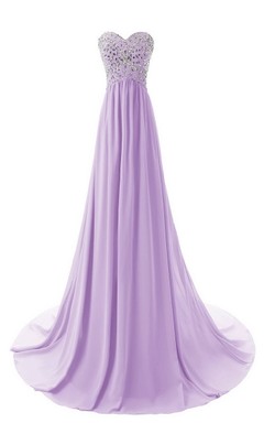 Vestido largo de gasa con escote corazón y corpiño de cristal.