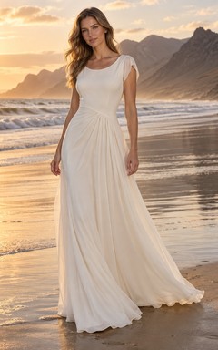 Vestido de novia sencillo de georgette con escote joya, corte en A, mangas cortas y cola.