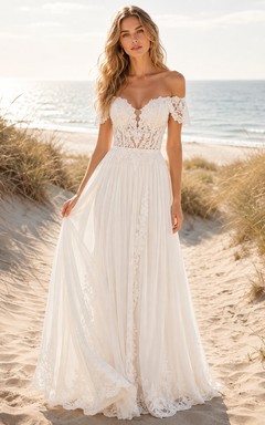 Robe de mariée bohème en dentelle florale, épaules dénudées, décolleté cœur, manches courtes illusion, coupe trapèze et traîne.