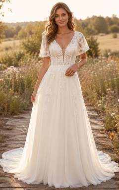 Vestido de novia campestre de tul, corte en A, escote en V, mangas con volantes, cola larga y espalda baja en V.