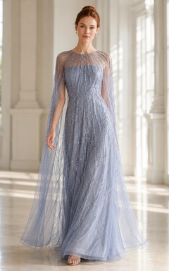 Robe de soirée bleu acier en tulle illusion, coupe trapèze, ornée de perles linéaires, idéale pour les événements formels et les soirées.