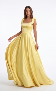 Robe de bal trapèze en satin jonquille avec bretelles à nœud et corsage perlé