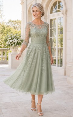 Robe de mariée en dentelle sauge et tulle, coupe trapèze, manches 3/4, encolure bateau, longueur thé