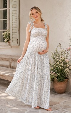 Robe de maternité blanche à fleurs, bretelles nouées, taille basse et longueur jardin