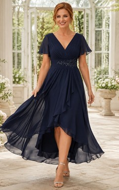Robe de cérémonie bleu marine anniversaire, col V, manches papillon, en mousseline, coupe trapèze asymétrique, ourlet arrondi.