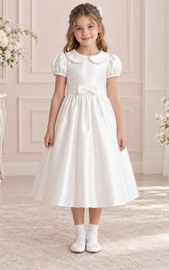 Vestido de niña de flores vintage blanco de corte A, largo hasta la rodilla, de satén, con mangas abullonadas, cuello y lazo en la espalda.