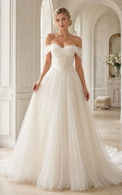 Vestido de novia de tul con corte en A y hombros descubiertos y cintura baja.