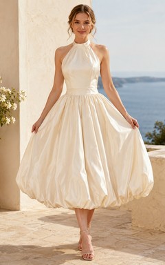 Vestido de novia bohemio de corte A con escote halter y falda abullonada hasta la rodilla