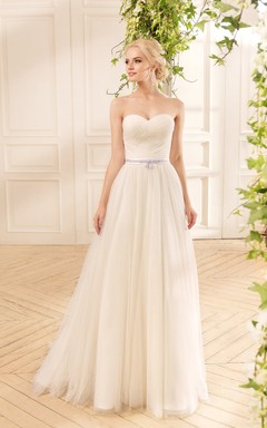 Robe longue trapèze en tulle illusion, épaules dénudées, manches 3-4, avec entrecroisement et plis