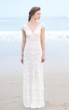 Robe de mariée bohème à décolleté plongeant et manches courtes, dos nu en V profond