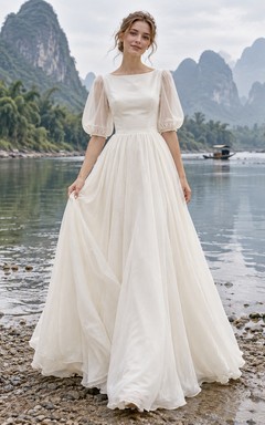Vestido de novia sencillo y modesto con escote barco, mangas abullonadas y corte en A.