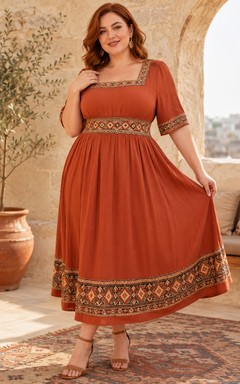 Vestido bohemio de gasa color óxido con cuello cuadrado y manga corta, largo hasta la rodilla y corte en A.