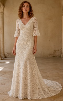 Vestido de novia bohemio de manga tres cuartos, estilo sirena, con escote en V, encaje geométrico con medallón y cola catedral.