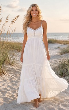 Vestido de novia bohemio romántico de gasa, largo hasta el suelo, con escote en V, corte en A y tirantes finos.