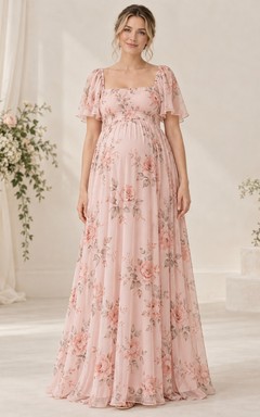 Vestido de dama de honor de gasa rosa con estampado floral, cuello cuadrado, mangas con volantes y corte imperio hasta el suelo.