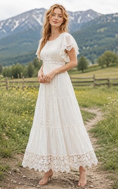 Vestido de novia estilo bohemio con cuello joya, volantes y encaje, largo hasta la rodilla, color pradera.