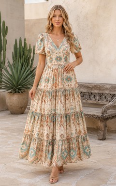 Vestido largo de invitada con escote en V y mangas abullonadas, de estilo azteca suave.